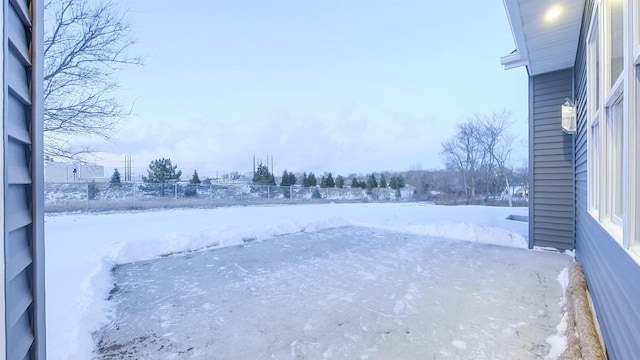 view of yard layered in snow