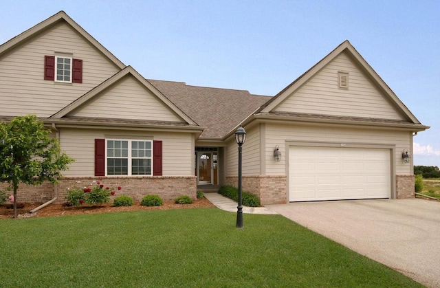 view of front of property with a garage and a front lawn