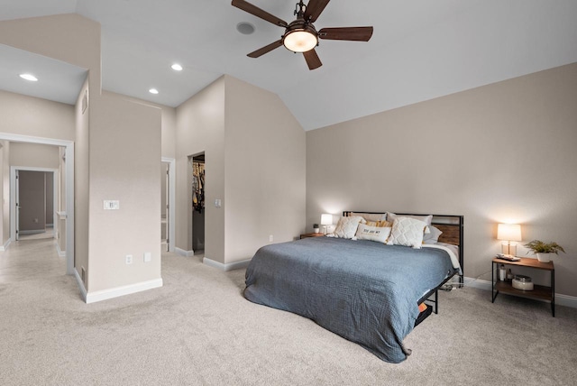 bedroom with vaulted ceiling, light colored carpet, and ceiling fan