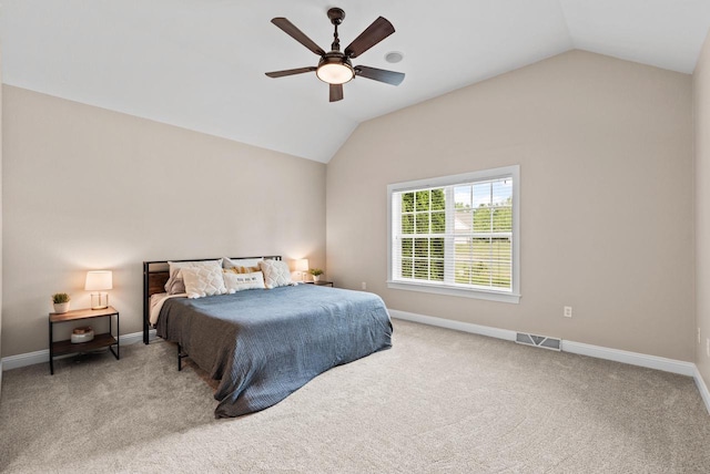 bedroom featuring lofted ceiling, carpet, and ceiling fan