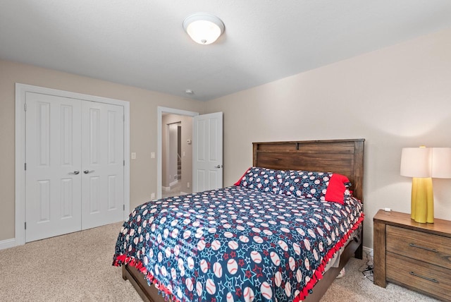 carpeted bedroom with a closet