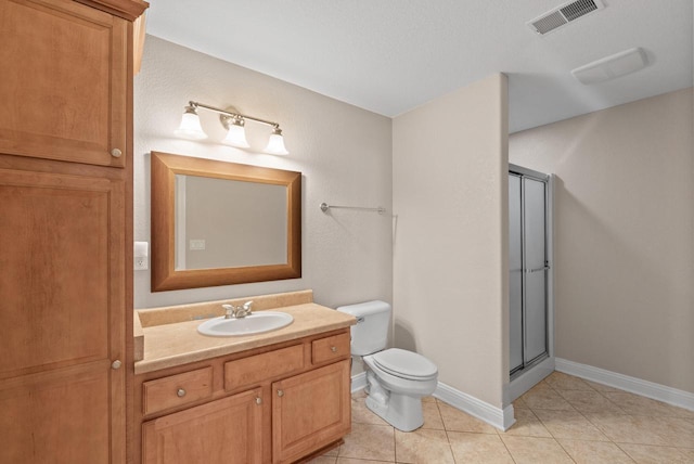 bathroom with vanity, an enclosed shower, tile patterned floors, and toilet