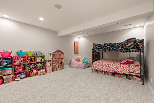 bedroom with beamed ceiling and carpet flooring