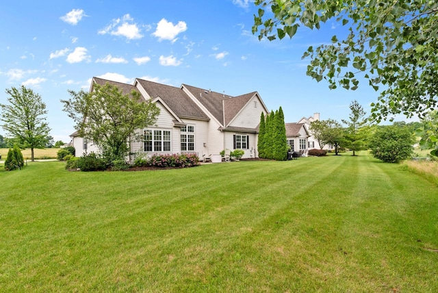 back of house featuring a yard