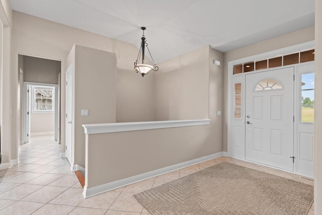 entryway with light tile patterned floors