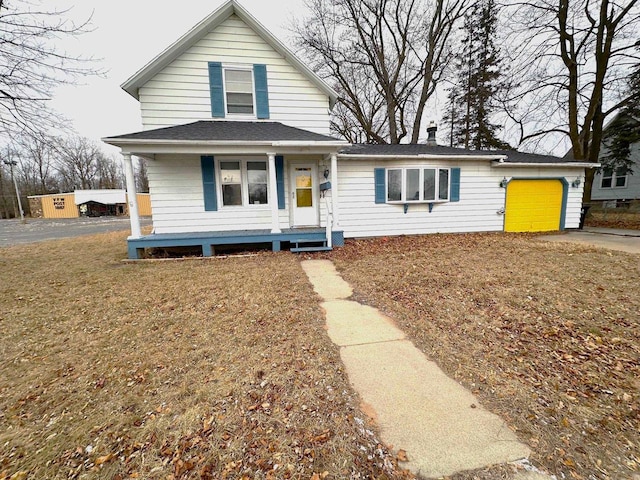 view of front of property featuring a garage and a porch