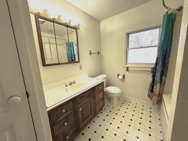 full bathroom with vanity, shower / tub combo, a textured ceiling, and toilet