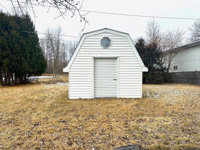 view of outbuilding featuring a yard