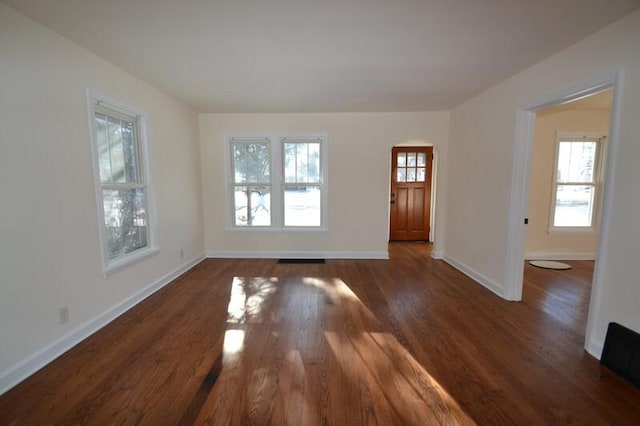 interior space with dark hardwood / wood-style flooring