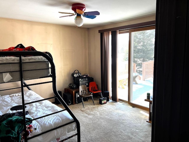 bedroom with access to outside, light colored carpet, and ceiling fan