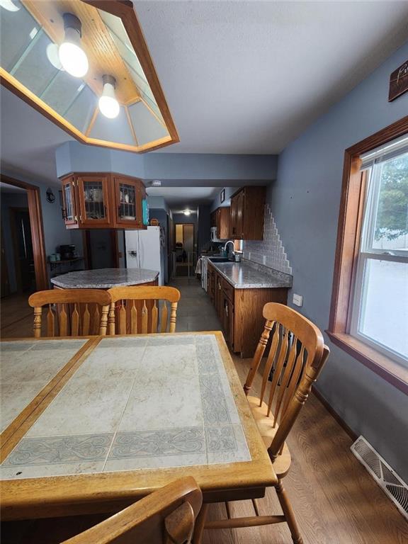 dining area featuring dark hardwood / wood-style floors