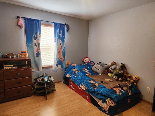 bedroom with light hardwood / wood-style floors