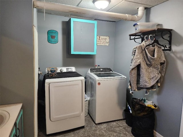 clothes washing area with independent washer and dryer