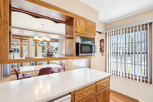 kitchen featuring a chandelier and light hardwood / wood-style floors