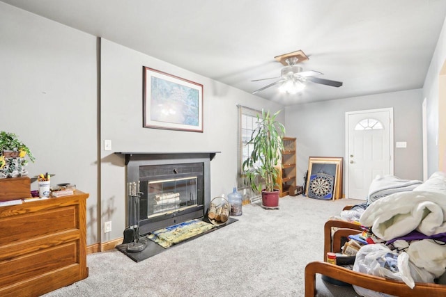 living room featuring ceiling fan and carpet flooring