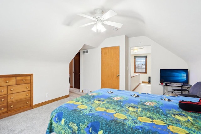 carpeted bedroom with vaulted ceiling and ceiling fan