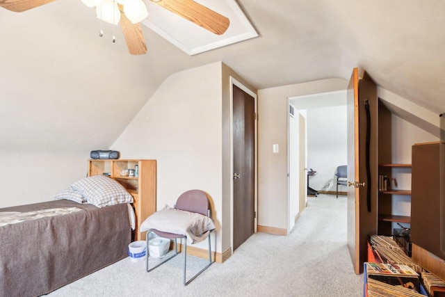 bedroom featuring lofted ceiling, light colored carpet, and ceiling fan