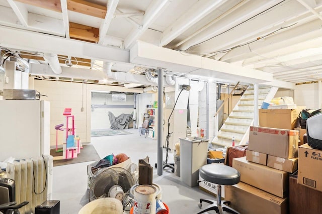 basement with white refrigerator