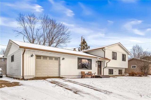 split level home featuring a garage