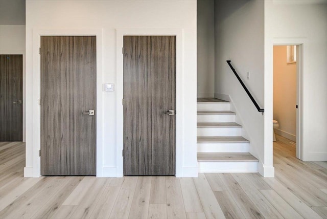 stairway featuring wood-type flooring