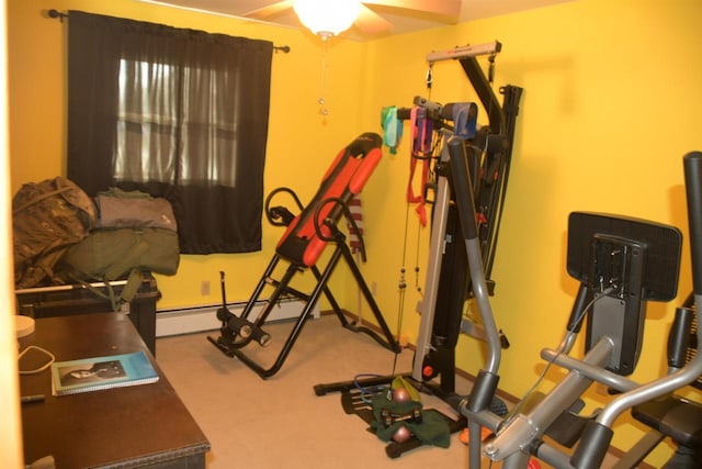 workout room with a baseboard radiator and carpet floors