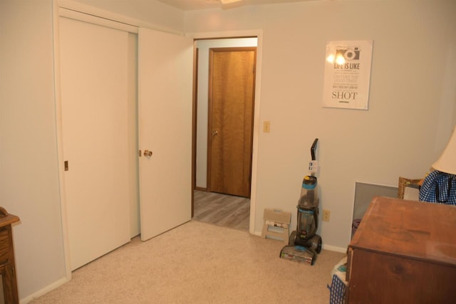 bedroom featuring light carpet