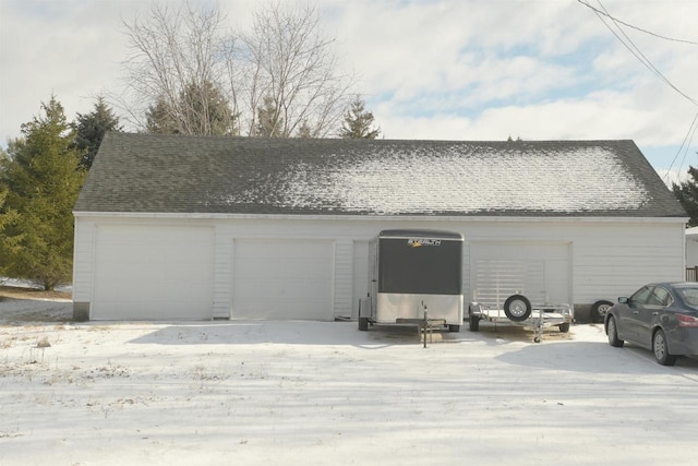 view of snow covered garage