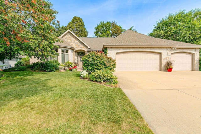 view of front facade with a garage and a front yard