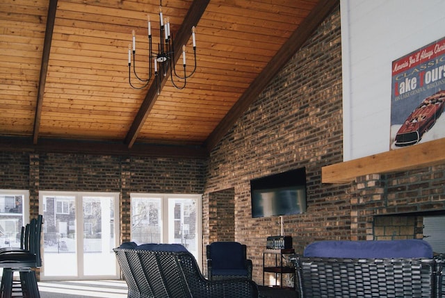 living room featuring beamed ceiling, brick wall, high vaulted ceiling, and wooden ceiling