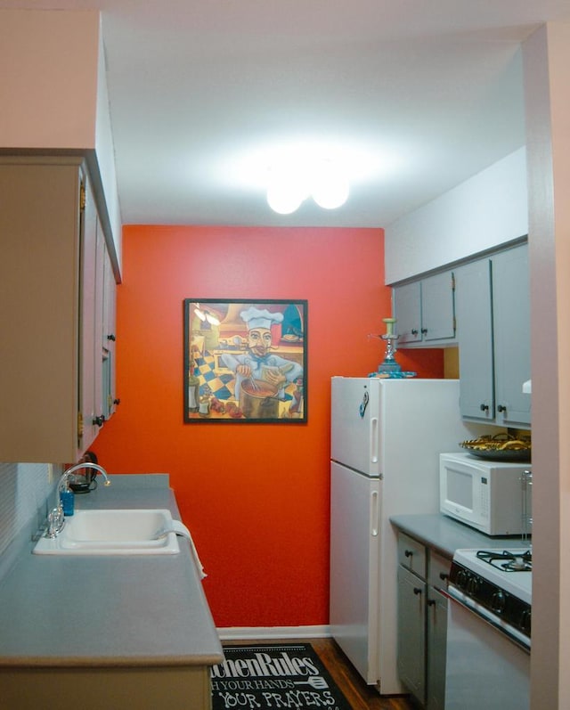 kitchen with sink and white appliances