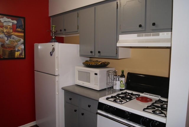 kitchen with white appliances and gray cabinets