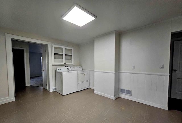 clothes washing area featuring washer and clothes dryer