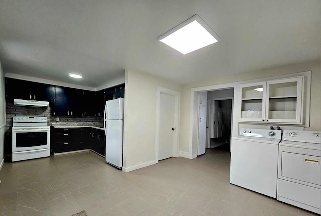 kitchen featuring separate washer and dryer, white appliances, and tasteful backsplash