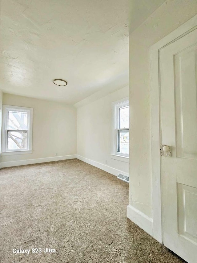 empty room with carpet floors