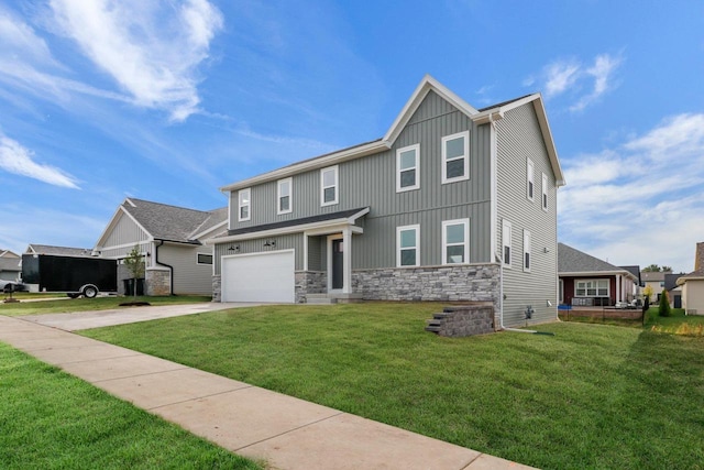 view of front of property featuring a garage and a front yard