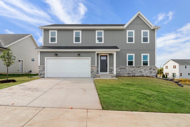 view of front of home featuring a garage and a front yard