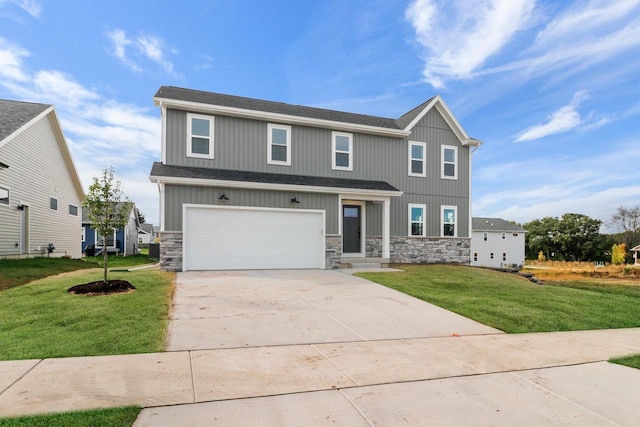 view of front of property featuring a garage and a front yard