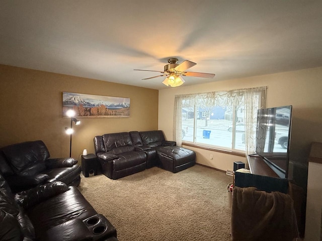 living room with a ceiling fan and carpet floors