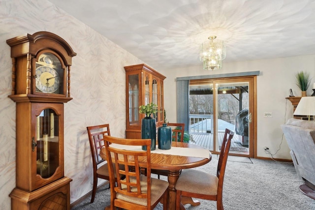 dining room featuring an inviting chandelier and carpet floors