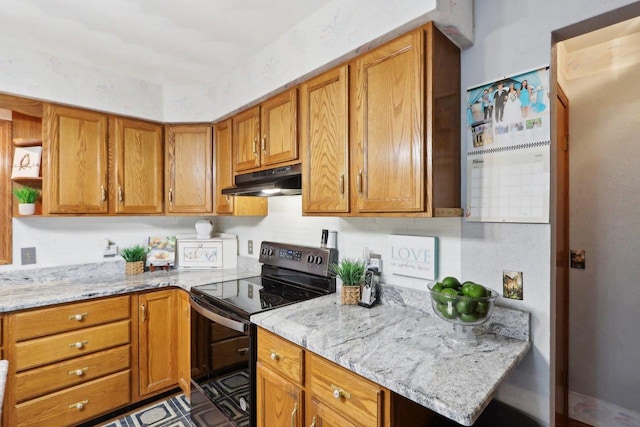 kitchen with light stone counters and electric range oven