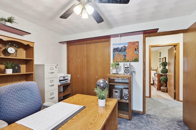 office featuring light carpet and ceiling fan