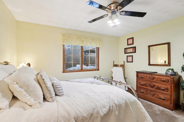 bedroom featuring light colored carpet and ceiling fan