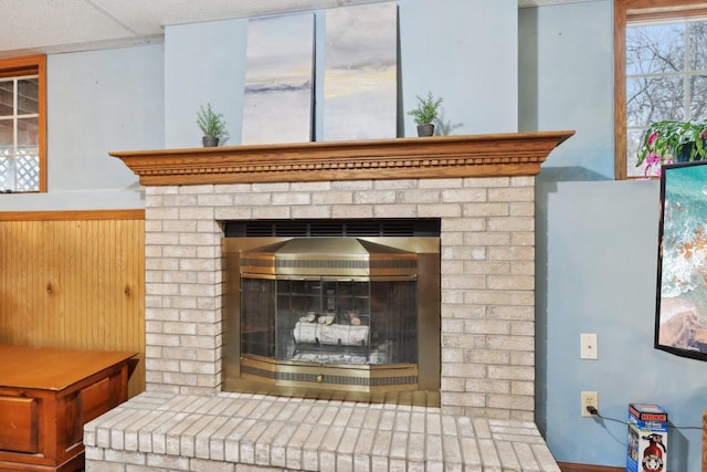 room details featuring a brick fireplace