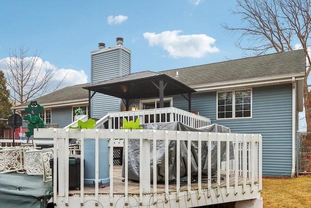 exterior space featuring a wooden deck and a playground