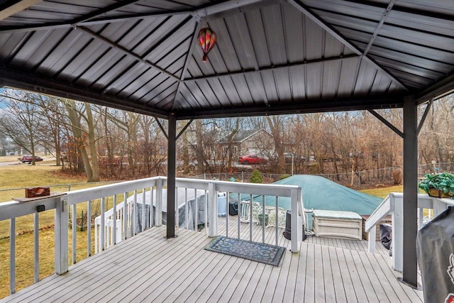 deck featuring a gazebo and a lawn