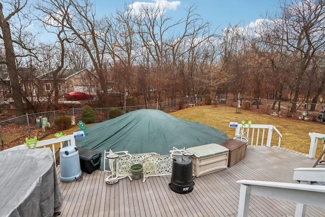 wooden deck featuring a yard