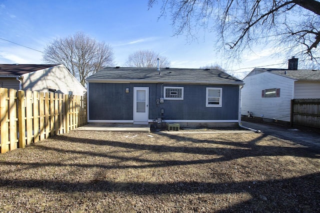 rear view of house featuring cooling unit