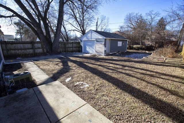 view of yard with a garage and an outdoor structure