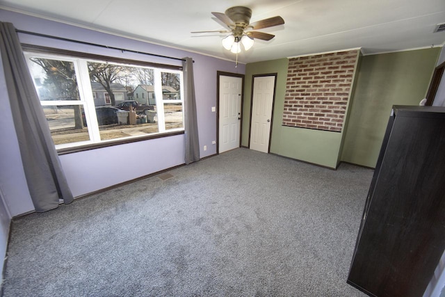 unfurnished bedroom featuring light carpet and ceiling fan