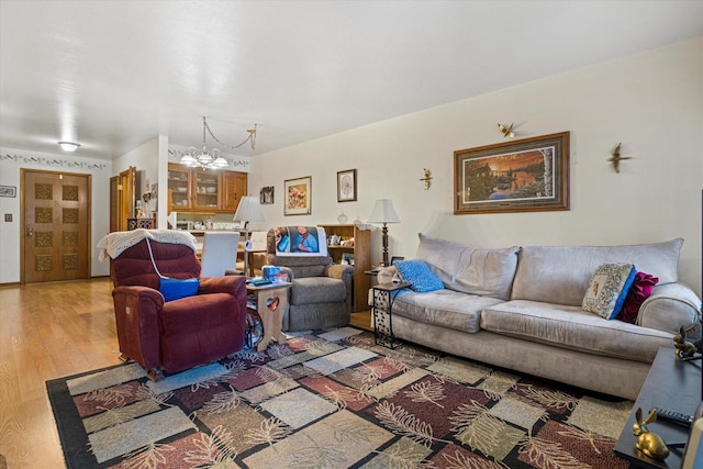 living room featuring hardwood / wood-style floors and a chandelier